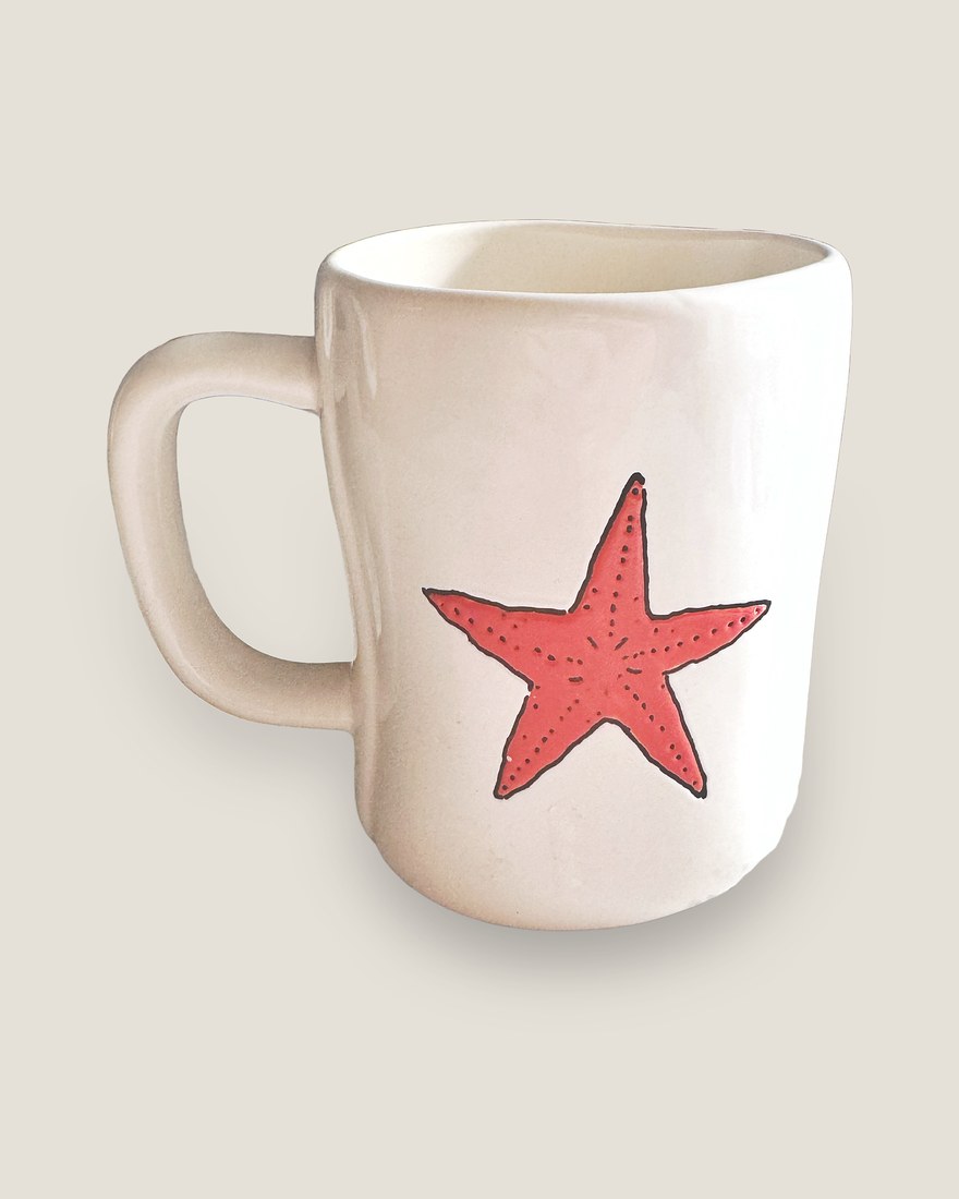 Hand-glazed starfish mug, on one of Inky's studio backdrops — item still unchanged